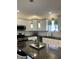 Modern kitchen with white subway tile backsplash, stainless appliances, and island seating at 359 N Jefferson St, Martinsville, IN 46151