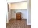 Laundry area featuring updated cabinet with laminate countertops and hardwood flooring at 359 N Jefferson St, Martinsville, IN 46151