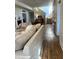 Inviting living room with hardwood floors, fireplace, and staircase bathed in natural light at 359 N Jefferson St, Martinsville, IN 46151