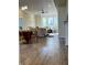 Open-concept living room with bay window, ceiling fan, and hardwood flooring at 359 N Jefferson St, Martinsville, IN 46151