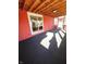 Enclosed porch with wooden ceiling, red siding, and carpeted floor at 359 N Jefferson St, Martinsville, IN 46151