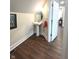 Bathroom featuring modern fixtures, pedestal sink, and wooden-look flooring at 359 N Jefferson St, Martinsville, IN 46151