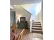 Interior staircase with carpeted steps and decorative accents on the landing at 359 N Jefferson St, Martinsville, IN 46151