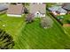 Aerial view of a well-manicured lawn and a beautiful home with mature trees and landscaping in a suburban neighborhood at 4309 Summerhaven Dr, New Palestine, IN 46163