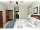 Bedroom featuring a bed with a patchwork quilt and a doorway leading to the bathroom at 4309 Summerhaven Dr, New Palestine, IN 46163