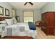 Cozy bedroom with neutral walls, carpet and patchwork quilt at 4309 Summerhaven Dr, New Palestine, IN 46163