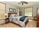 Bedroom featuring a bed with a patchwork quilt and two windows allowing plenty of natural light at 4309 Summerhaven Dr, New Palestine, IN 46163