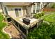 A cozy deck featuring a built-in grill area and a table set, perfect for outdoor entertaining and relaxation at 4309 Summerhaven Dr, New Palestine, IN 46163