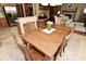 Inviting dining area with a wooden table, seating for six, and view to the kitchen at 4309 Summerhaven Dr, New Palestine, IN 46163