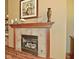 Close-up of a fireplace with decorative mantel, tiling, and hearth at 4309 Summerhaven Dr, New Palestine, IN 46163