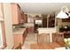 Modern kitchen with stainless steel appliances, tile backsplash, and ample cabinet space at 4309 Summerhaven Dr, New Palestine, IN 46163
