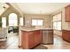 Open kitchen with granite countertops, stainless steel appliances, and seamless access to living area at 4309 Summerhaven Dr, New Palestine, IN 46163
