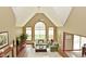 Bright living room with vaulted ceiling, large windows, and comfortable seating at 4309 Summerhaven Dr, New Palestine, IN 46163