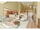 Spacious living area with an open floor plan, fireplace, and staircase to upper level at 4309 Summerhaven Dr, New Palestine, IN 46163