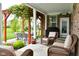 Inviting covered back porch with a seating area and backyard view at 4415 Voyageur Way, Carmel, IN 46074