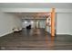 Open concept finished basement with stylish flooring, wet bar, and neutral decor, ideal for entertaining at 4415 Voyageur Way, Carmel, IN 46074