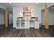 Finished basement with wet bar, featuring modern cabinets, open layout with stylish lighting at 4415 Voyageur Way, Carmel, IN 46074