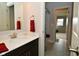 Modern bathroom featuring a clean vanity, mirror, and stylish red towels at 4415 Voyageur Way, Carmel, IN 46074