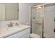 Bathroom features a glass enclosed shower and vanity with white countertop at 4415 Voyageur Way, Carmel, IN 46074