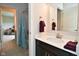 Modern bathroom featuring a clean vanity, mirror, and stylish burgundy towels at 4415 Voyageur Way, Carmel, IN 46074