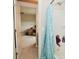 Hall bathroom featuring shower and peek into adjacent bedroom at 4415 Voyageur Way, Carmel, IN 46074