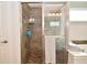 Bathroom featuring a tiled glass shower with a showerhead and tiled floors at 4415 Voyageur Way, Carmel, IN 46074