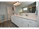 Bathroom with a large vanity featuring double sinks, a mirror, and tiled flooring at 4415 Voyageur Way, Carmel, IN 46074