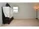 Bright bedroom featuring large window, neutral carpet, and stylish decor at 4415 Voyageur Way, Carmel, IN 46074