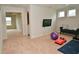 Bonus room featuring natural light, a wall-mounted TV, a yoga ball, and workout accessories at 4415 Voyageur Way, Carmel, IN 46074