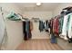 Walk-in closet featuring an abundance of hanging storage, shelving, and carpeted flooring at 4415 Voyageur Way, Carmel, IN 46074
