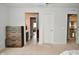 Spacious hallway with natural light leads to bedrooms and bathrooms, featuring modern decor at 4415 Voyageur Way, Carmel, IN 46074