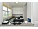 Bright home office with granite counters, built-in cabinets, and a large window for natural light at 4415 Voyageur Way, Carmel, IN 46074