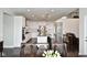 Spacious, modern kitchen with white cabinets, stainless steel appliances, and large center island at 4415 Voyageur Way, Carmel, IN 46074