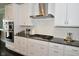 Modern kitchen showcasing granite countertops, stainless steel appliances, and a white subway tile backsplash at 4415 Voyageur Way, Carmel, IN 46074