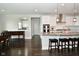 Bright kitchen with stainless steel appliances, granite countertops, and a breakfast bar with seating at 4415 Voyageur Way, Carmel, IN 46074
