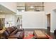Spacious living area with dark wood floors, comfortable seating, and an open view of the home at 4415 Voyageur Way, Carmel, IN 46074