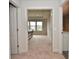 Main bedroom featuring natural light, a tray ceiling, and carpeted flooring at 4415 Voyageur Way, Carmel, IN 46074