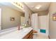 Bathroom features a shower/tub combo with a white shower curtain and a single sink at 464 Hummingbird Ln, Whiteland, IN 46184