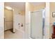 Bathroom featuring a shower and tub combo, tile flooring, and a glass shower door at 464 Hummingbird Ln, Whiteland, IN 46184