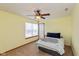 This bedroom features tan walls, a ceiling fan, one window and carpet throughout at 464 Hummingbird Ln, Whiteland, IN 46184
