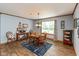 Bright dining room featuring a wooden table set and decorative accents at 464 Hummingbird Ln, Whiteland, IN 46184