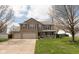 Charming two-story home with a well-manicured lawn and a welcoming front porch at 464 Hummingbird Ln, Whiteland, IN 46184