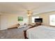 Spacious main bedroom features a ceiling fan, large windows and carpeting throughout at 464 Hummingbird Ln, Whiteland, IN 46184