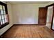 Bedroom featuring hardwood floors, light walls, with a door leading to another room at 505 W 40Th St, Indianapolis, IN 46208