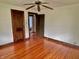 The bedroom showcases hardwood floors, wood trim, and neutral wall colors blending comfort with classic charm at 505 W 40Th St, Indianapolis, IN 46208