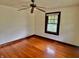 The bedroom features hardwood floors, a ceiling fan, and natural light for a comfortable and welcoming atmosphere at 505 W 40Th St, Indianapolis, IN 46208
