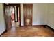 Bedroom showcasing hardwood floors, light walls, and views of other rooms at 505 W 40Th St, Indianapolis, IN 46208
