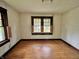 Sun-lit bedroom featuring hardwood floors and a bright window providing natural light at 505 W 40Th St, Indianapolis, IN 46208