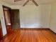 This bedroom showcases hardwood floors, wood trim, and neutral wall colors for an inviting, classic appeal at 505 W 40Th St, Indianapolis, IN 46208