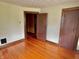 The bedroom showcases hardwood floors, wood trim, and neutral wall colors adding to its overall comfort and style at 505 W 40Th St, Indianapolis, IN 46208